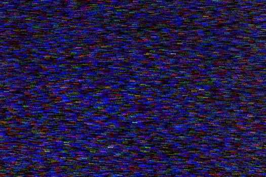 abstract random colored noise dots blurred by motion on black background.