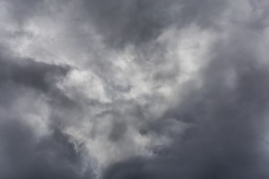 gray incoming storm clouds closeup backdrop, captured with telephoto lens