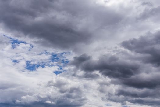 gray incoming storm clouds closeup backdrop, captured with telephoto lens