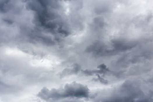 gray incoming storm clouds closeup backdrop, captured with telephoto lens