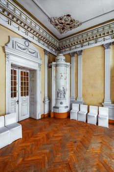 Corner of the room with a stove in the abandoned palace