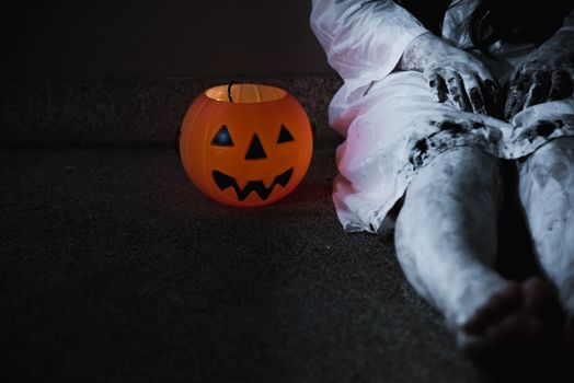 Woman ghost horror her have pumpkin beside body, halloween concept