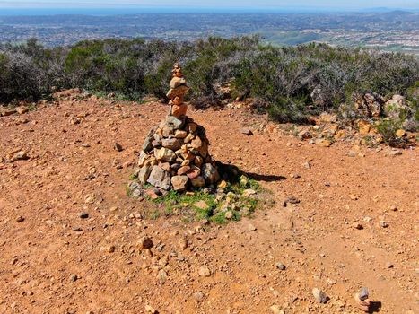 Balancing and concentration pile of rocks. Relaxation and meditation through simplicity harmony and rock balance lead to health and wellness. pile of rocks made on the top of the mountain. California