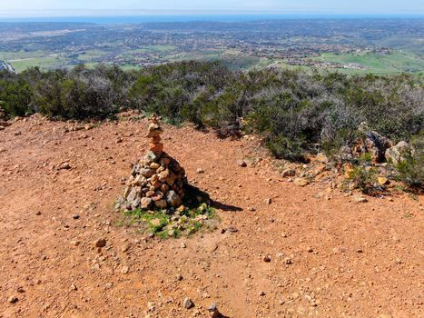 Balancing and concentration pile of rocks. Relaxation and meditation through simplicity harmony and rock balance lead to health and wellness. pile of rocks made on the top of the mountain. California