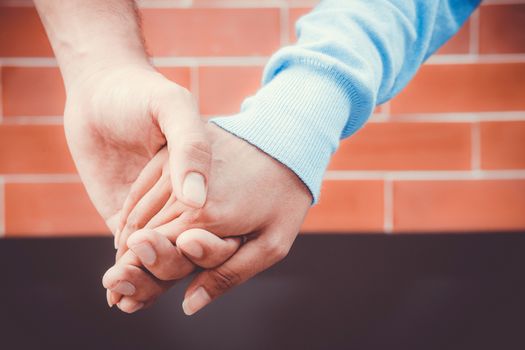 Hands with couple love together, Closeup of loving couple holding hands while walking outdoors.