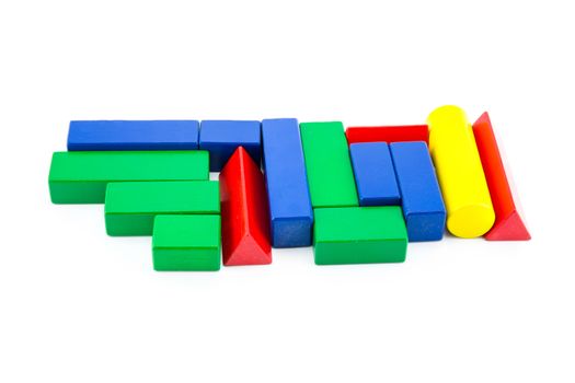 toy wood block multicolor building construction bricks isolated on white background.