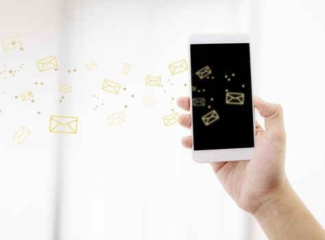 Hand holding man check and sending message with email in a phone on white background, communication concept.