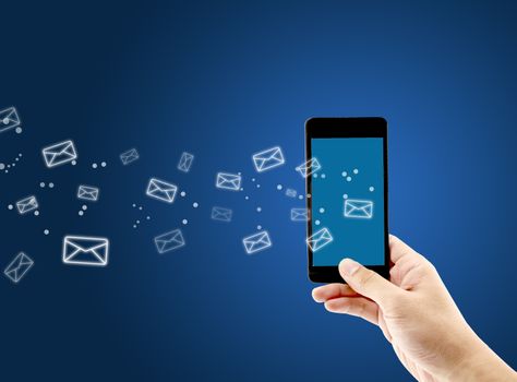 Hand holding man check and sending message with email in a phone on blue background, communication concept.