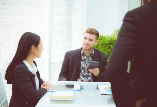 young business people making meeting and talking for analyzing marketing working at office on desk.