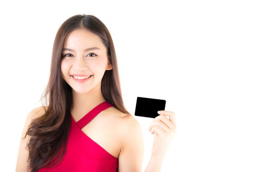Asian young woman with red dress holding a credit card thinking to spend money lots isolated on white background.