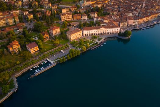 Aerial view of Lake Iseo at sunrise, on the left the city of lovere which runs along the lake,Bergamo Italy.