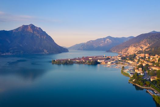 Aerial view of Lake Iseo at sunrise, on the right the port of lovere,background mountains(alps), Bergamo Italy.