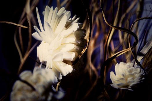 artificial flowers, mixed bouquet on a dark blue background