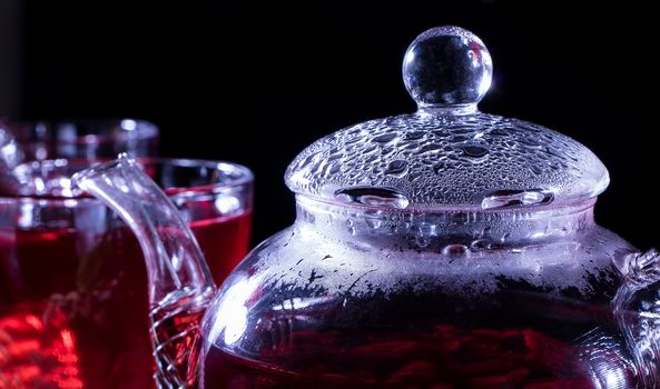 Hot teapot with tea and steam inside close-up. Tea parties, tea traditions and ceremonies. Zen traditions of the East. Hot drink, hot beverage or warm drink