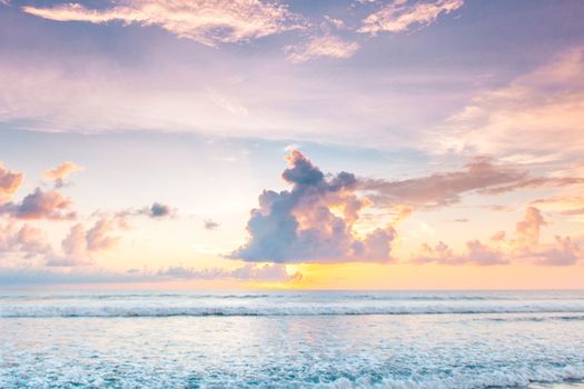 Morning seascape, beautiful sunrise in cloudy sky over the sea