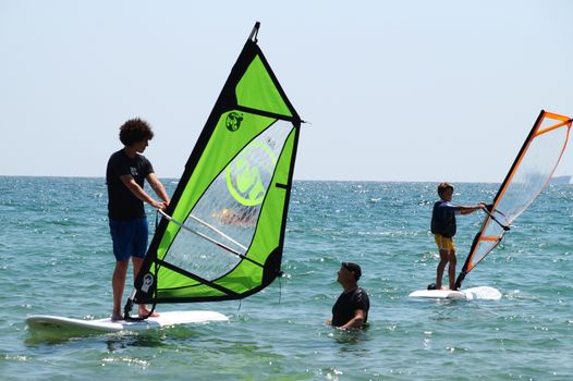 Varna, Bulgaria - July, 31,2020 instructor teaches windsurfing at sea