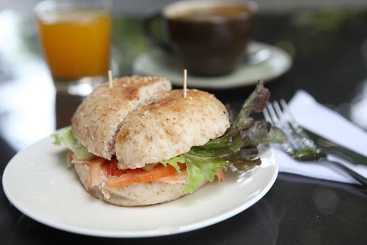 fresh bagel with salmon orange juice and coffee