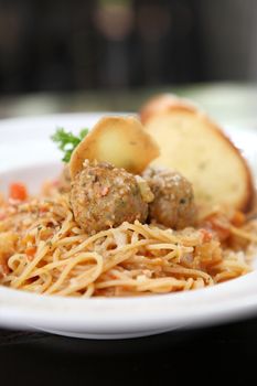 Spaghetti  Meatballs on wood background