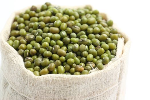 green mung bean on sack isolated in white background