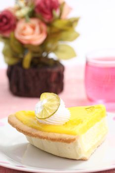 slice of lemon cheese cake with flower