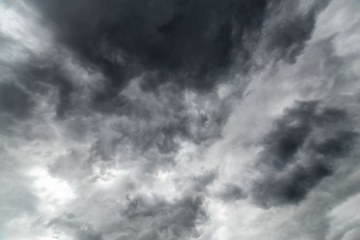gray incoming storm clouds dark closeup backdrop, captured on wide angle lens