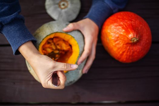 Hollowing out a pumpkin to prepare halloween lantern carving process