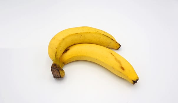 Real two yellow banana from Bangkok Thailand no retouch and white background studio shot and isolated.