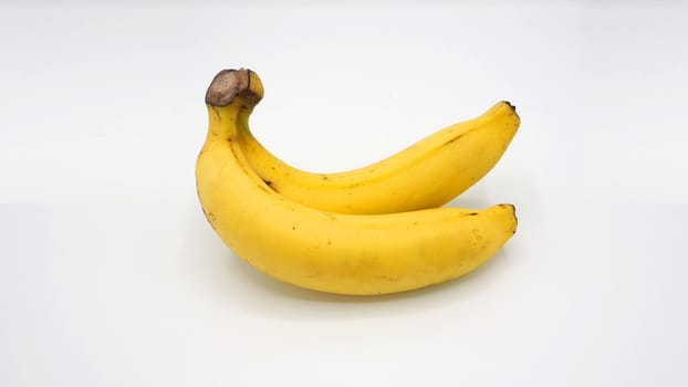 Real two yellow banana from Bangkok Thailand no retouch and white background studio shot and isolated.