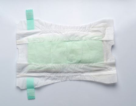 Baby diaper dry and soft texture fabric white color hygienic and comfortable tape type and white background studio shot