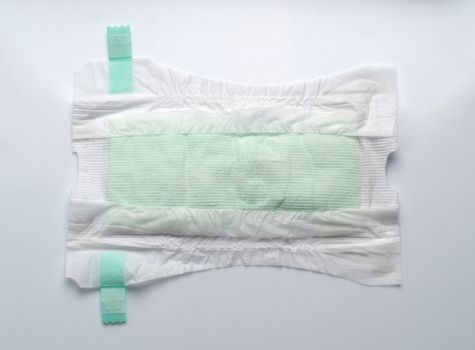 Baby diaper dry and soft texture fabric white color hygienic and comfortable tape type and white background studio shot