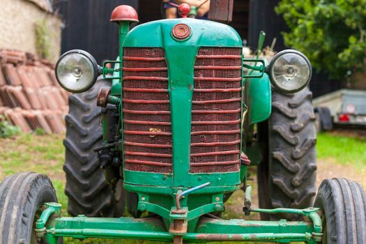 old tractor on a farm as a work tool.