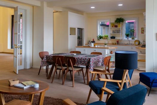 kitchen with flowered dining room, wooden chairs and blue accents. Modern Decor