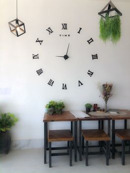 Roman numeral wall clock at the coffee shop.