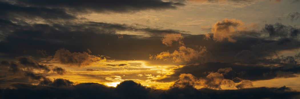 Panoramic view of dramatic clouds rising of sun floating in sky to change weather. Soft focus, blurred motion. Soft focus, motion blur sky majestic meteorology cloudscape.