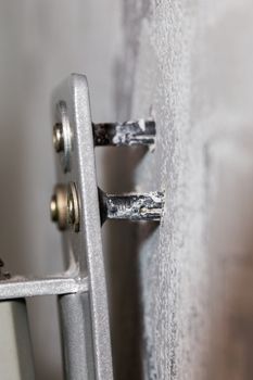 weak plastic dowels come out from wall and monitor or tv moun.