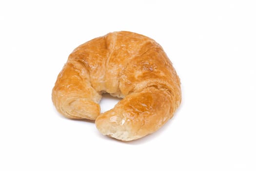 Croissant for breakfast isolated on a white background.