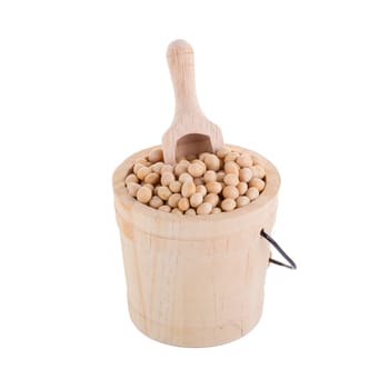 Soybeans in a wooden cup isolated on white background.