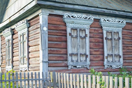 Wooden shutters on an old wooden house in Belarus. Authentic architecture. Shabby