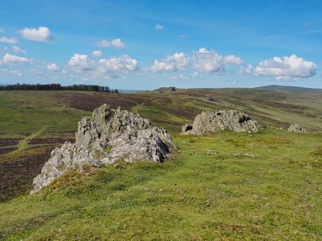 View from the shattered rocks at the Bronze Age or early Iron Age hill fort of Foel Drygarn looking over the rest of the Preseli Hills range, Pembrokeshire Coast National Park, Wales, UK