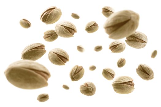 Salted pistachios levitate on a white background.