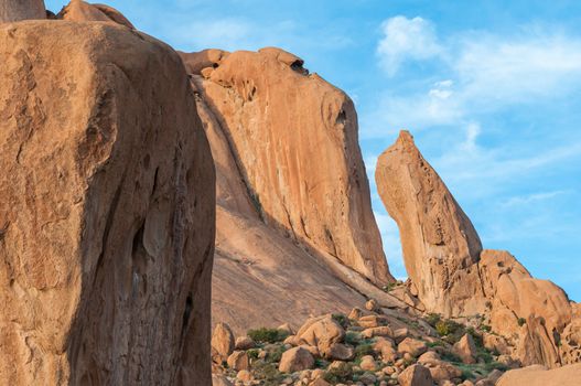 A granite needle and rock formation resembling a baboon face at the greater Spitzkoppe