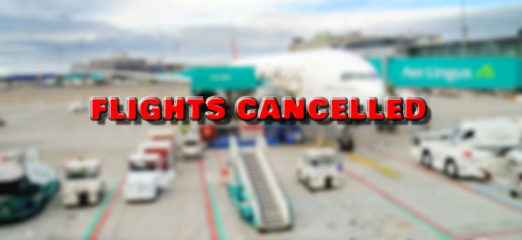 Plane at gate marked with cancelled sign waiting for passengers boarding. According to currently cancelled flights due to world pandemic of coronavirus.