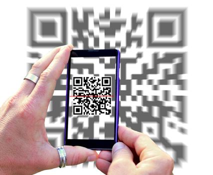 View over the mobile phone screen during scanning QR code isolated on white background. Hands holding mobile phone and scanning QR code.