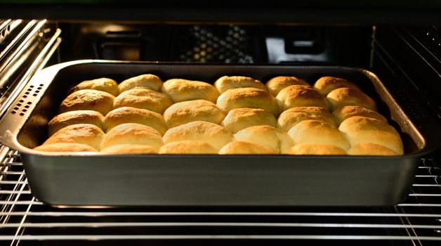 A View into the Baking Oven with Traditional Czech Curd Cakes in the Pan.