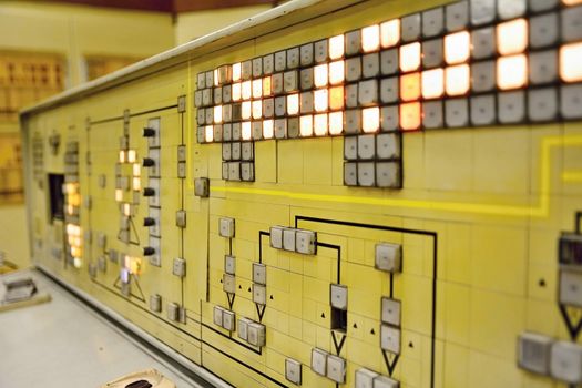 Control Room in Smelting Factory with Closeup Shot of an Old Vintage Control Panel with Many Buttons.