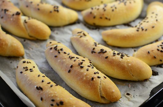 Homemade fresh baked white bread rolls called rohlik in traditional Czech cuisine. Typical Czech pastry.