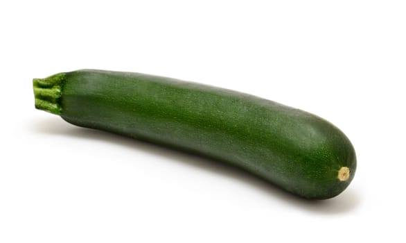 Whole green zucchini on white background.