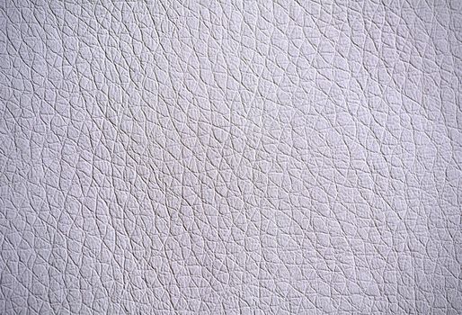 Full frame background of pebbled grey leather surface.