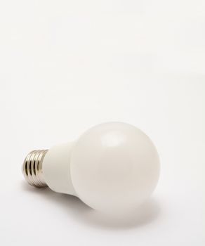 Close up of standard led light bulb on a white background.