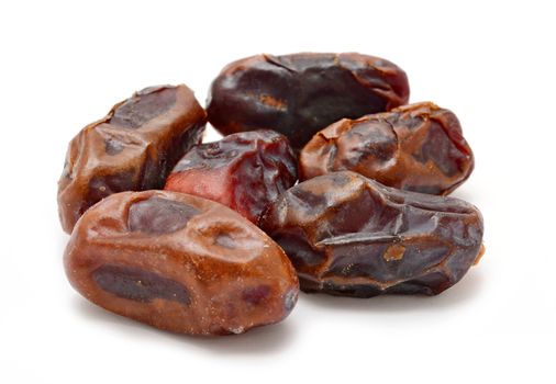 Group of natural Arabian dried dates on white background.